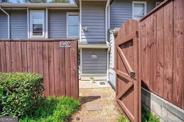 view of home's exterior with fence