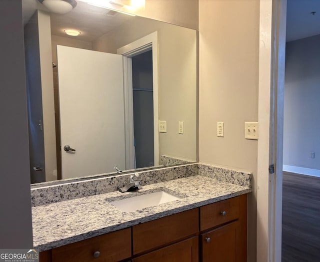 bathroom with vanity and baseboards