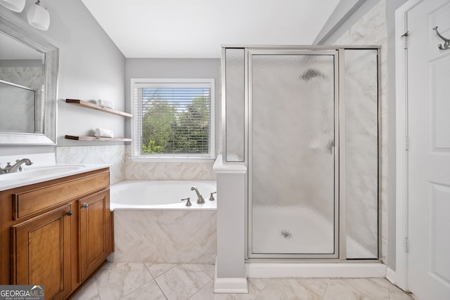 bathroom featuring a shower stall, vanity, marble finish floor, and a garden tub