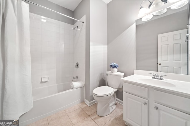 bathroom with baseboards, shower / bath combination with curtain, toilet, vanity, and tile patterned flooring