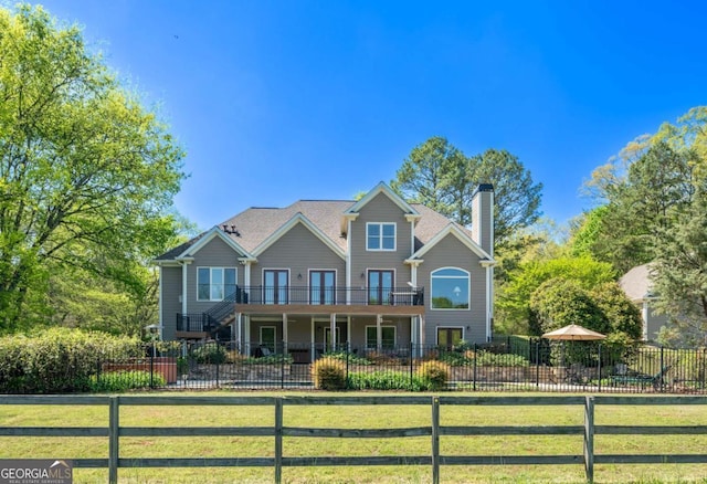 20 Rivercreek Xing, Kingston, GA 30145 - view of front facade with stairway, a fenced front yard, a chimney, and a deck