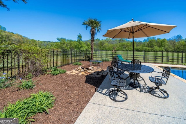20 Rivercreek Xing, Kingston, GA 30145 - fenced backyard featuring a patio area and a view of trees