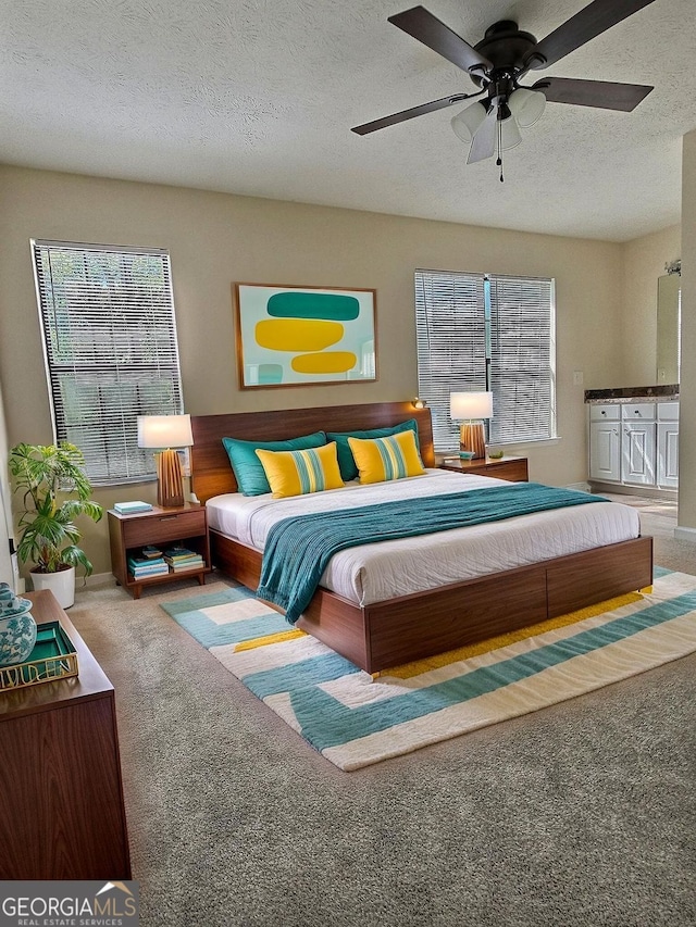 4460 Branchwood Ct, Loganville, GA 30052 - bedroom with a ceiling fan, multiple windows, carpet, and a textured ceiling