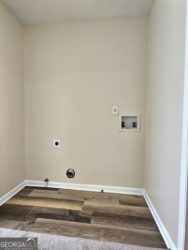 4460 Branchwood Ct, Loganville, GA 30052 - washroom with dark wood-style floors, electric dryer hookup, baseboards, and hookup for a washing machine