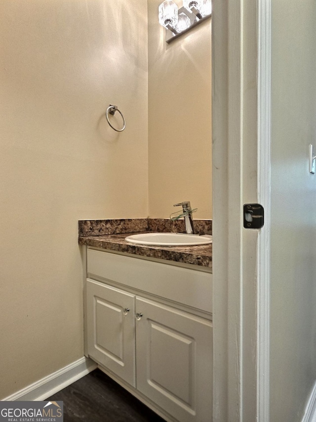 4460 Branchwood Ct, Loganville, GA 30052 - bathroom featuring wood finished floors, vanity, and baseboards