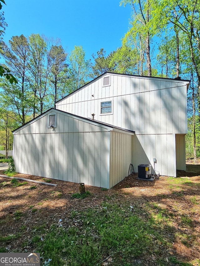 4460 Branchwood Ct, Loganville, GA 30052 - view of side of home with central AC and an outbuilding