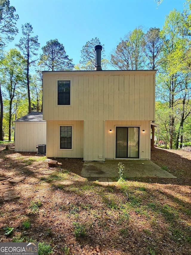 4460 Branchwood Ct, Loganville, GA 30052 - rear view of house with cooling unit and a patio area
