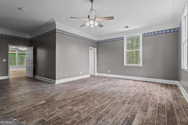 2455 Horseleg Creek Rd SW, Rome, GA 30165 - spare room with crown molding, ceiling fan with notable chandelier, visible vents, dark wood-style flooring, and baseboards
