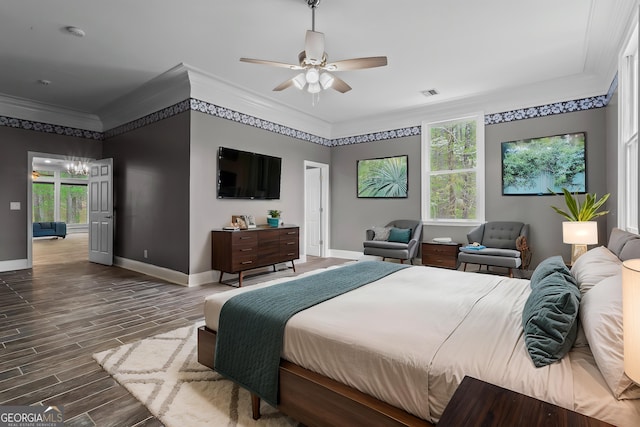 2455 Horseleg Creek Rd SW, Rome, GA 30165 - bedroom featuring visible vents, baseboards, dark wood finished floors, crown molding, and ceiling fan with notable chandelier