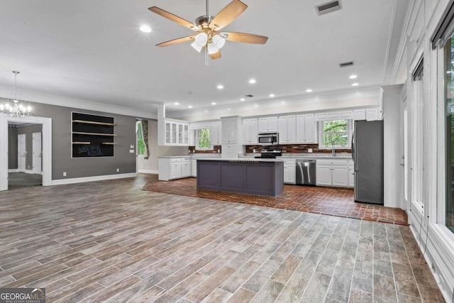 2455 Horseleg Creek Rd SW, Rome, GA 30165 - kitchen featuring open floor plan, a kitchen island, visible vents, stainless steel appliances, and ceiling fan with notable chandelier