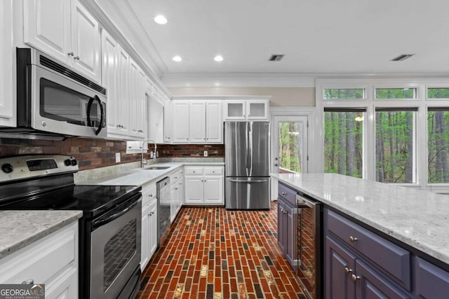 2455 Horseleg Creek Rd SW, Rome, GA 30165 - kitchen with visible vents, appliances with stainless steel finishes, a sink, beverage cooler, and brick floor