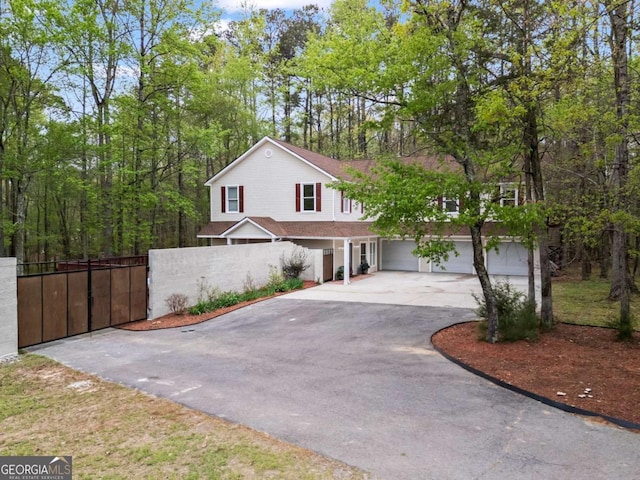 2455 Horseleg Creek Rd SW, Rome, GA 30165 - view of front facade featuring a garage, driveway, and fence