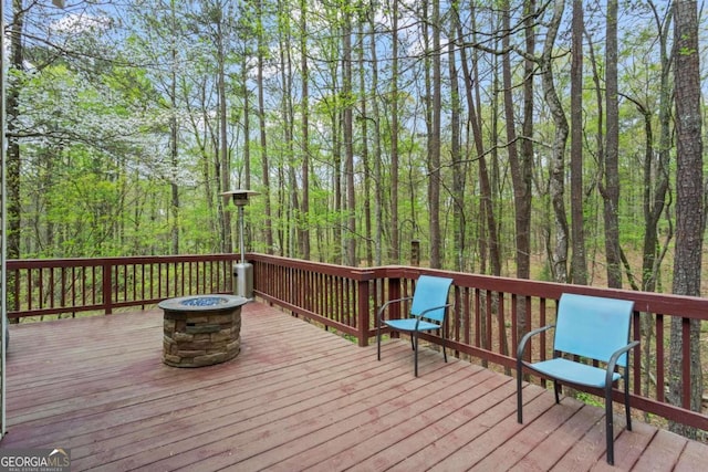 2455 Horseleg Creek Rd SW, Rome, GA 30165 - wooden terrace with a view of trees and a fire pit