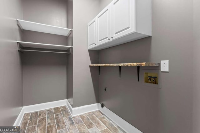 2455 Horseleg Creek Rd SW, Rome, GA 30165 - laundry room featuring washer hookup, baseboards, cabinet space, and electric dryer hookup