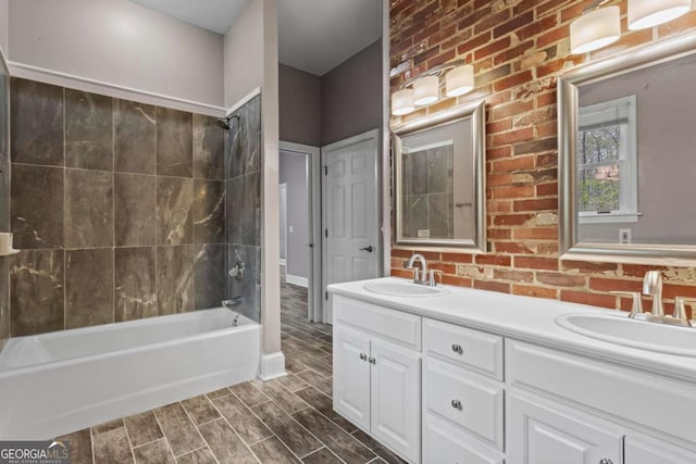 2455 Horseleg Creek Rd SW, Rome, GA 30165 - bathroom featuring wood tiled floor, double vanity, a sink, and shower / washtub combination
