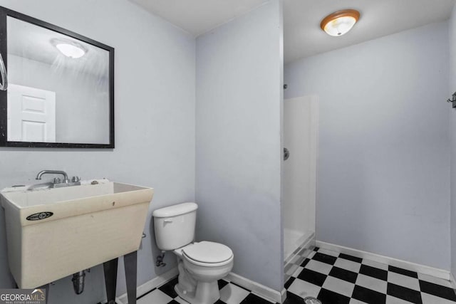 2455 Horseleg Creek Rd SW, Rome, GA 30165 - bathroom featuring toilet, tile patterned floors, a shower stall, and a sink