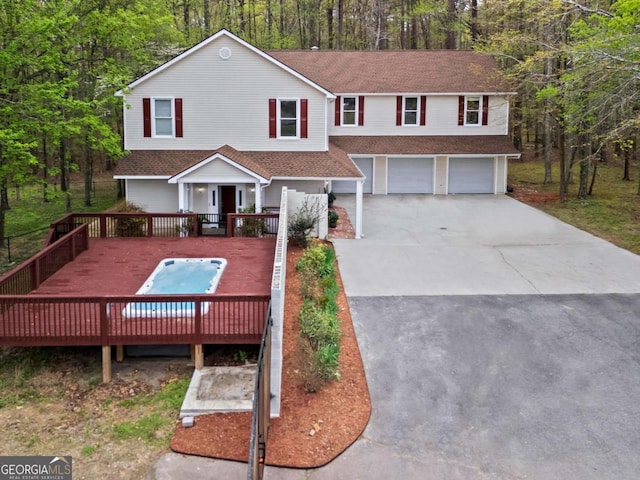 2455 Horseleg Creek Rd SW, Rome, GA 30165 - view of front of property featuring a garage, a shingled roof, a wooden deck, and concrete driveway