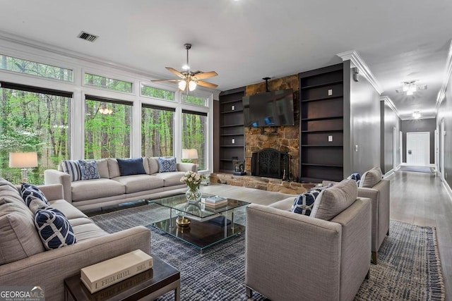 2455 Horseleg Creek Rd SW, Rome, GA 30165 - living area featuring ornamental molding, a ceiling fan, visible vents, wood finished floors, and built in shelves