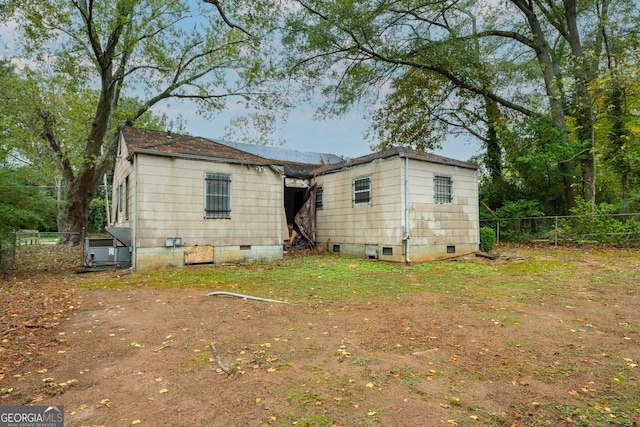 3074 Delowe Dr, Atlanta, GA 30344 - back of house featuring crawl space and fence