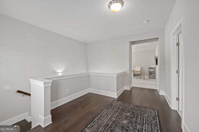 living area with carpet floors and baseboards