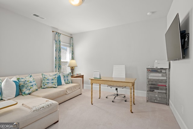 office area featuring visible vents, baseboards, and carpet floors