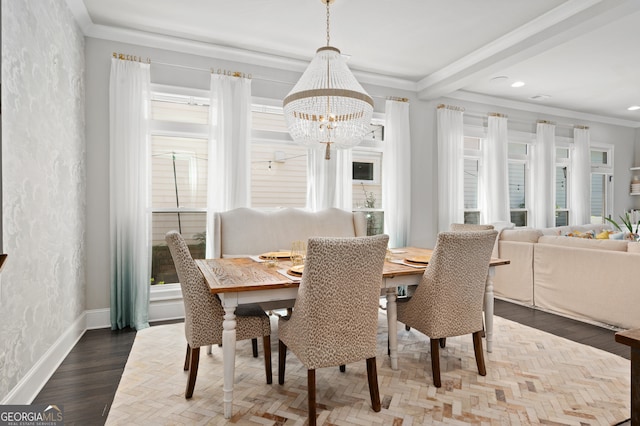 dining space featuring a healthy amount of sunlight, an inviting chandelier, and baseboards