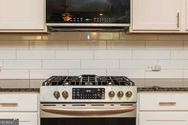 3495 Delegate Aly, Scottdale, GA 30079 - kitchen featuring dark stone countertops, white cabinets, appliances with stainless steel finishes, and tasteful backsplash