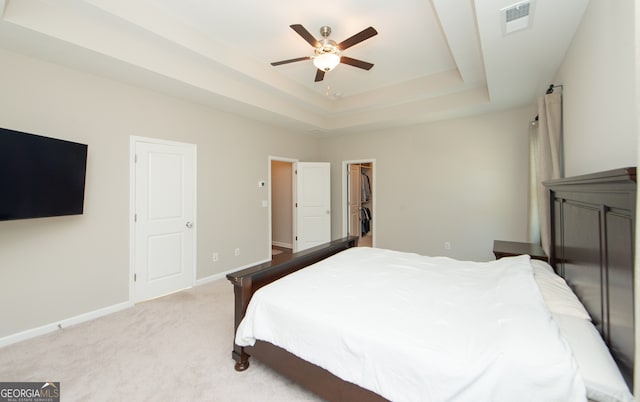 3495 Delegate Aly, Scottdale, GA 30079 - carpeted bedroom featuring a raised ceiling, visible vents, a walk in closet, baseboards, and ceiling fan