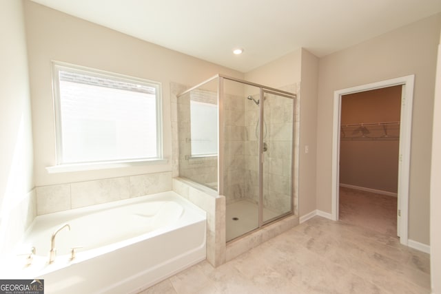 3495 Delegate Aly, Scottdale, GA 30079 - full bathroom featuring a bath, tile patterned floors, a spacious closet, and a stall shower