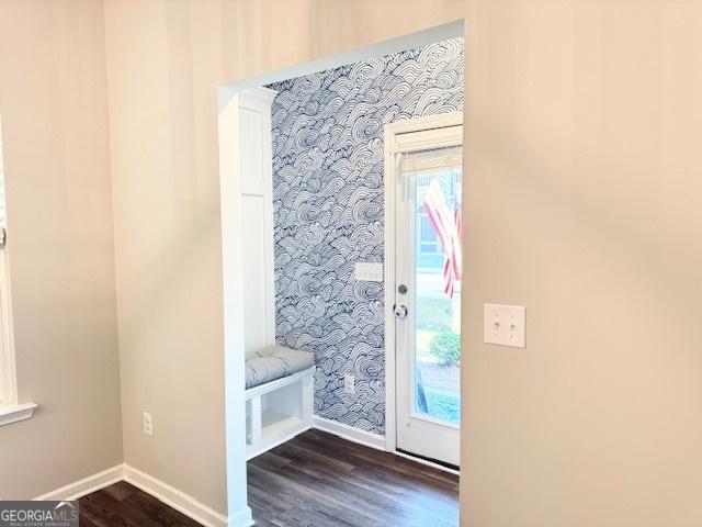 3495 Delegate Aly, Scottdale, GA 30079 - doorway featuring dark wood finished floors, baseboards, and wallpapered walls