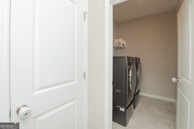 3495 Delegate Aly, Scottdale, GA 30079 - laundry room with washing machine and dryer, baseboards, and laundry area