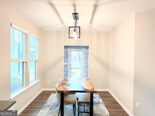 3495 Delegate Aly, Scottdale, GA 30079 - dining space featuring baseboards and dark wood-type flooring