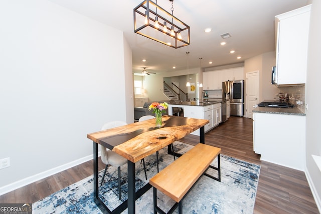 3495 Delegate Aly, Scottdale, GA 30079 - dining space featuring dark wood-style floors, baseboards, visible vents, recessed lighting, and stairway