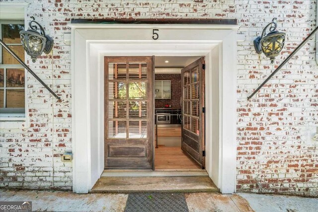 65 Peachtree Memorial Dr NW Unit 5, Atlanta, GA 30309 - view of exterior entry with brick siding