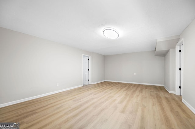 interior space featuring baseboards and light wood-style floors