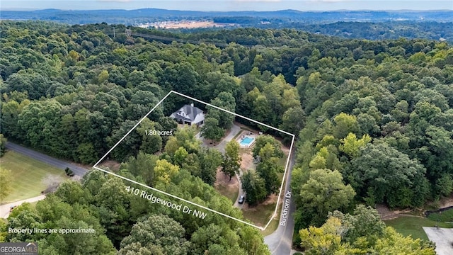 bird's eye view featuring a view of trees