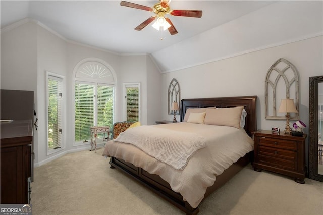bedroom with lofted ceiling, a ceiling fan, baseboards, and light carpet
