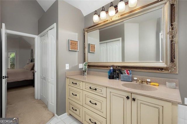ensuite bathroom with vanity and connected bathroom