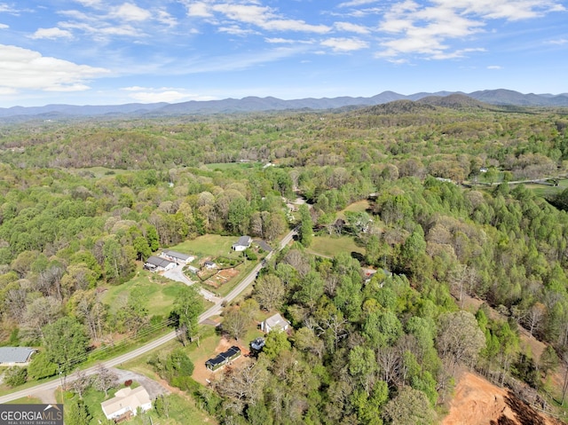 aerial view featuring a mountain view and a forest view