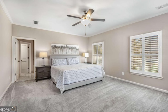 bedroom featuring carpet flooring, baseboards, ornamental molding, and visible vents