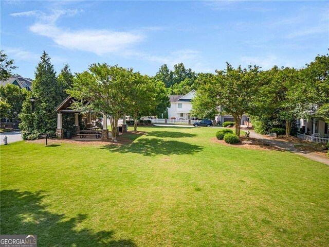 exterior space featuring a yard and a gazebo