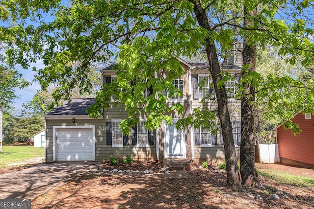 3742 Linecrest Rd, Ellenwood, GA 30294 - colonial house with a garage, driveway, and a chimney