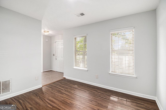 3742 Linecrest Rd, Ellenwood, GA 30294 - spare room featuring visible vents, baseboards, and wood finished floors