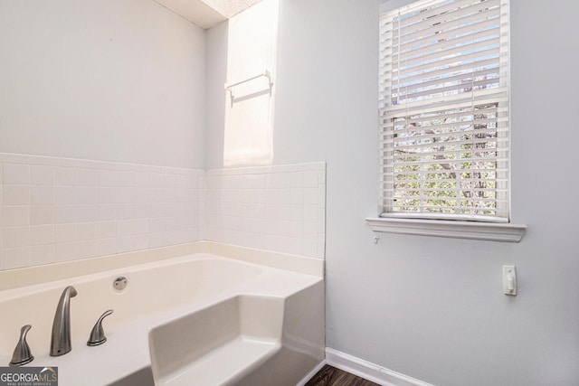 3742 Linecrest Rd, Ellenwood, GA 30294 - bathroom with a bath and baseboards
