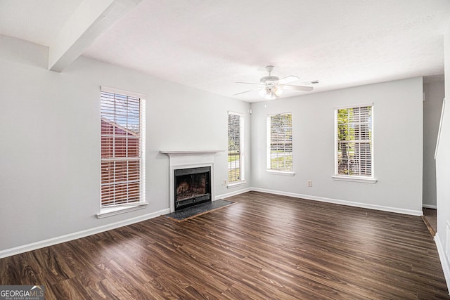 3742 Linecrest Rd, Ellenwood, GA 30294 - unfurnished living room featuring visible vents, baseboards, ceiling fan, dark wood-style floors, and a fireplace with flush hearth