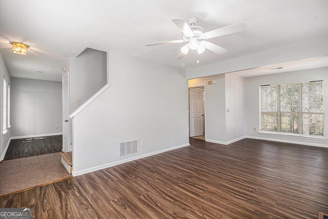 3742 Linecrest Rd, Ellenwood, GA 30294 - unfurnished living room featuring wood finished floors, ceiling fan, baseboards, and visible vents