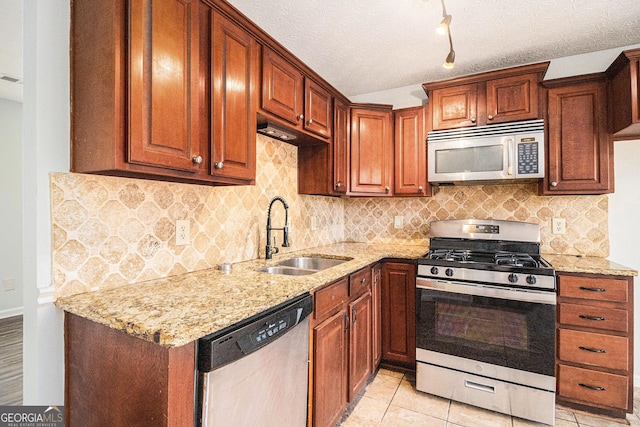 3742 Linecrest Rd, Ellenwood, GA 30294 - kitchen with appliances with stainless steel finishes, decorative backsplash, a sink, and light stone counters