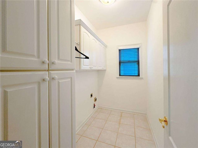 3195 Vickery Dr NE, Marietta, GA 30066 - laundry room featuring hookup for an electric dryer, light tile patterned floors, baseboards, and cabinet space