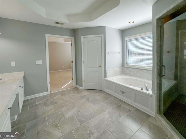3195 Vickery Dr NE, Marietta, GA 30066 - full bath with visible vents, baseboards, a shower stall, a jetted tub, and vanity