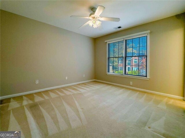3195 Vickery Dr NE, Marietta, GA 30066 - empty room with ceiling fan, light colored carpet, baseboards, and visible vents
